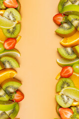 Citrus fruits and strawberries, composition with copy space flat lay, top view. Summer vertical background