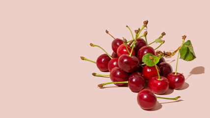 Cherries on pink background isolated, copy space, mock up
