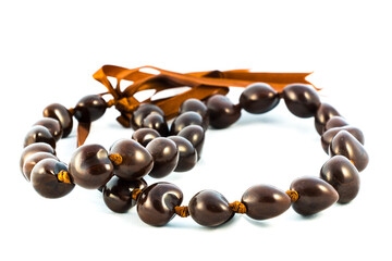 An authentic kukui nut lei from Hawaii isolated on white.