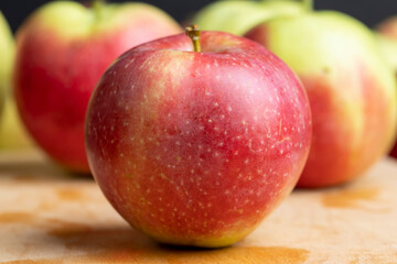 Fresh red and green apples on the kitchen table