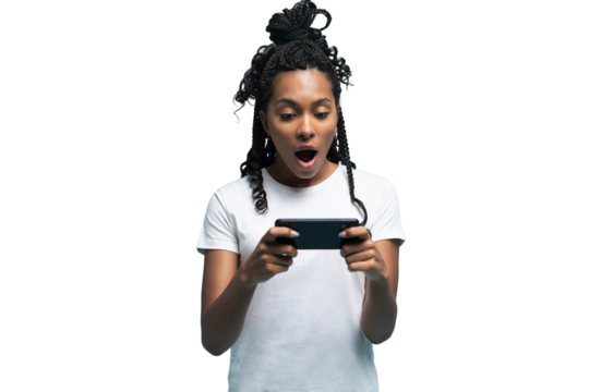 Positive curly haired ethnic woman uses mobile phone checks messages and reads news holds modern cellular in hands looks with curious happy expression isolated over transparent background
