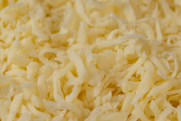 Hard cheese with holes grated into thin small slices