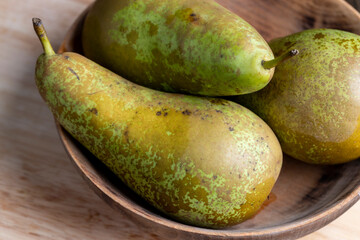 Ripe green pears on the table