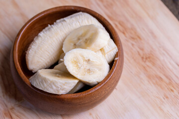 Sliced ripe banana on a cutting board