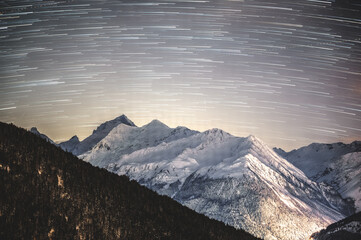 Star trails and the glow of the valley in Switzerland 4