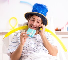 Young man celebrating his birthday in hospital