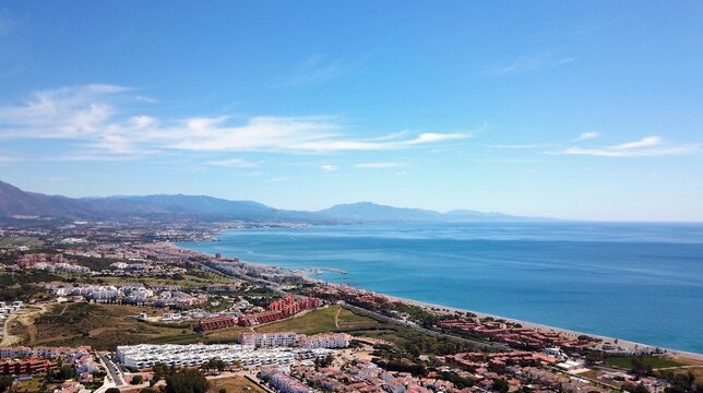 aerial view overlooking Manilva coast holiday homes and beach on the Costa del Sol as well as Duquesa Port on the Mediterranean Sea, Andalusia, Estepona, Marbella, Manilva, Malaga, Spain