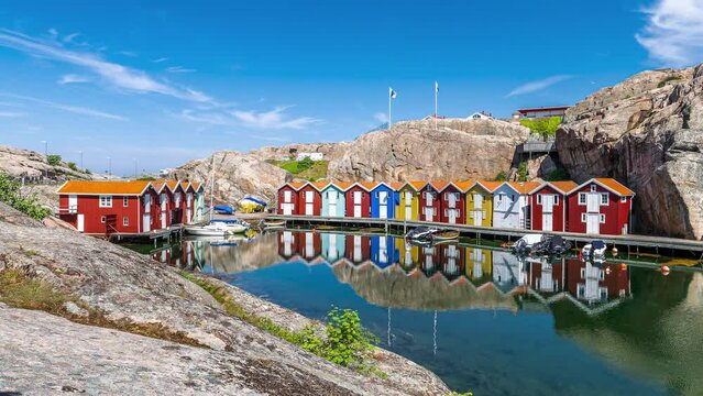 Zoom in time lapse of Idyllic colorful fisherman cabins Smogenbryggan in Smogen, Sweden. Typical Swedish wooden house constructions. 