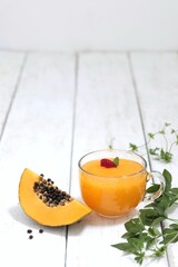 Papaya smoothie, juice in a transparent cup, papaya, fruit, on the table, vitamin drink, puree, fresh juice, background, background image