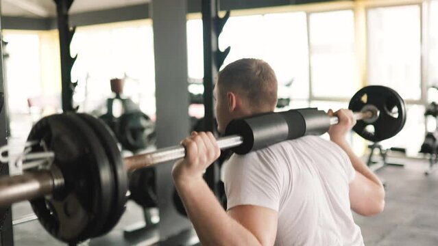 A male fitness enthusiast performing a series of challenging barbell exercises, emphasizing his dedication to regular training and physical well-being.