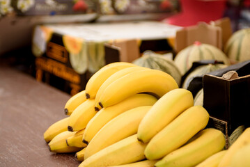 Bunch of bananas close up. Tropical fruits on the market counter.