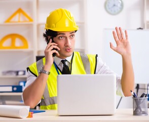 Male construction engineer working in the office