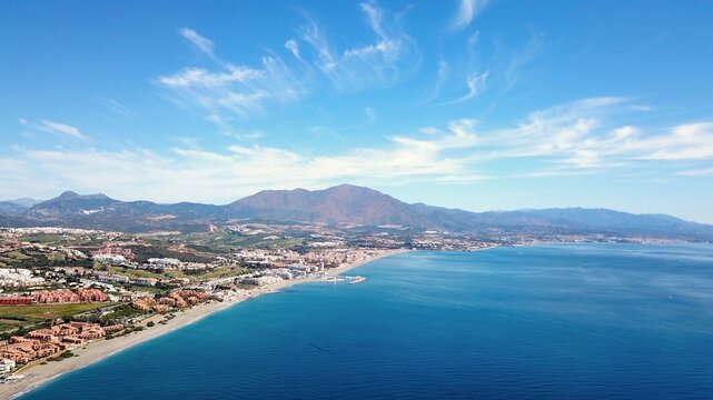 aerial view overlooking Manilva and Duquesa Port on the Mediterranean Sea and mountains of the Sierra Bermeja in the backgrou, Andalusia, Estepona, Marbella, Manilva, Malaga, Spain