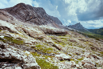 landscape with mountains, clouds and rocks