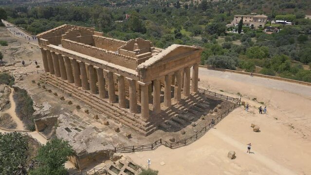 flying back view Temple of Concordia in Valley of the Temples in Agrigento