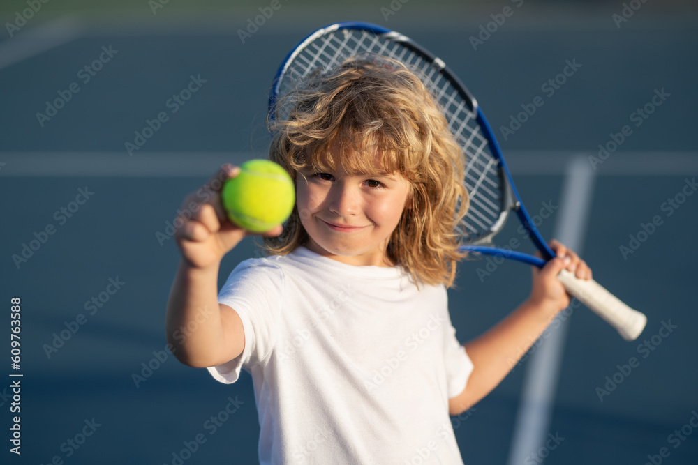 Wall mural Tennis child player on tennis court. Sport concept.