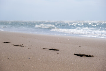 Beach sand with footsteps 