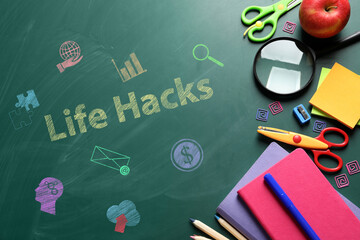 Words Life Hacks, drawings and stationery on green chalkboard, top view