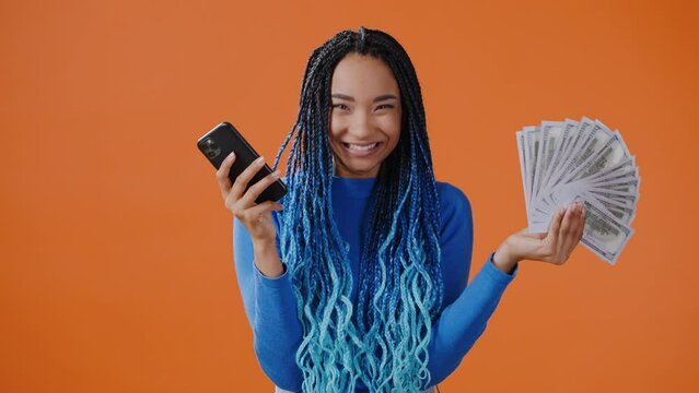 African American woman takes loan easily using mobile phone