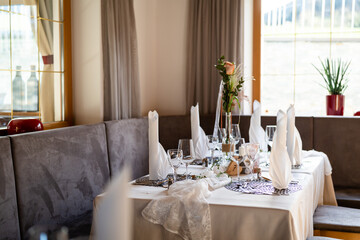 Decorated Gala dinner table with wine glasses and decorative napkins for a wedding