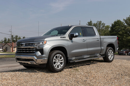 Chevrolet Silverado 1500 display at a dealership. Chevy offers the Silverado in WT, Trail Boss, LT, RST, and Custom models.