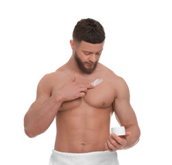 Obraz premium Handsome man applying body cream onto his chest on white background