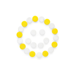 Happy emoticon made of antidepressants on white background, top view
