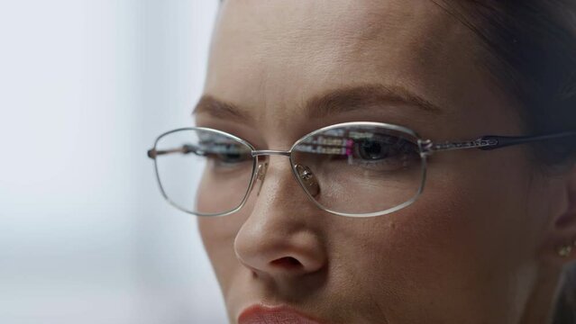 Data code reflecting glasses closeup. Software engineer woman programming work