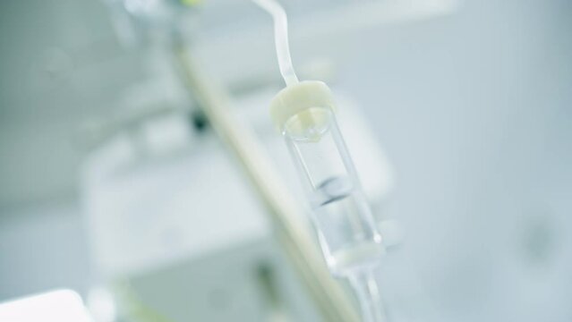 Intravenous saline bag in the operating room before the start of a surgical procedure in a medical clinic