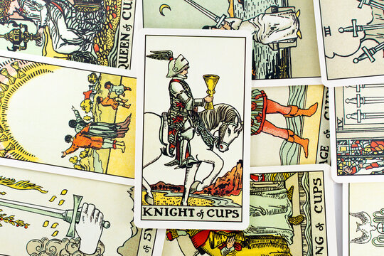 Madrid, Spain - May 22, 2023: Tarot cards, Rider Waite tarot cards, the knight of cups vintage card in the foreground.