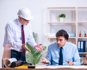 Two architects working on the project