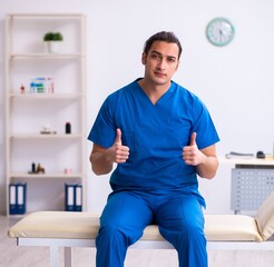 Young male doctor working in the clinic