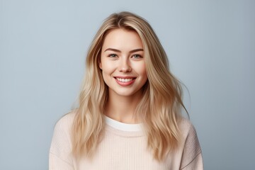 Headshot of a beautiful blond smiling young woman looking at the camera on gray background. Generative AI - obrazy, fototapety, plakaty