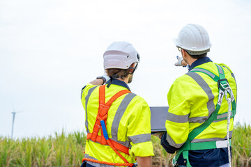 Maintenance engineer man working in wind turbine farm,Wind turbine operations that transform wind energy into electrical electricity,Clean energy concept saves the world.