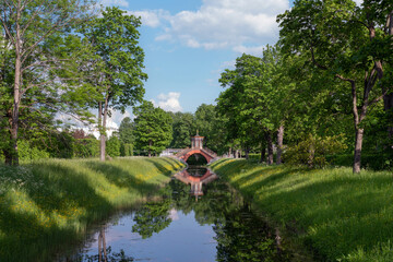 Cross bridge (Krestovy bridge) in the Alexander Park of Tsarskoye Selo on a sunny summer day,...