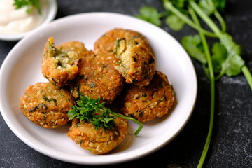 Falafel is a deep-fried ball or patty-shaped fritter in Middle Eastern cuisine made from ground chickpeas, broad beans, or both. 