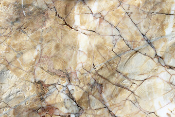 Brown stone with cracks on the surface