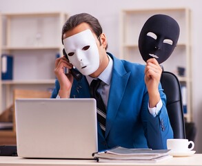 Young male employee wearing masks in the office