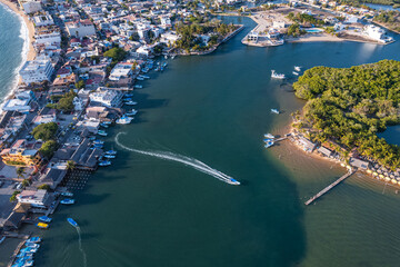 Boat crossing from the town of Barra de Navidad to a small island in the middle of a large lagoon. 