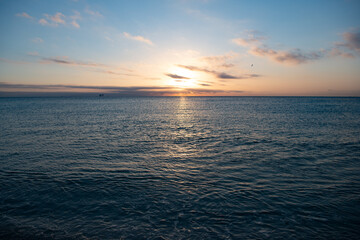 beautiful morning skyscape with sea water on the summer beach