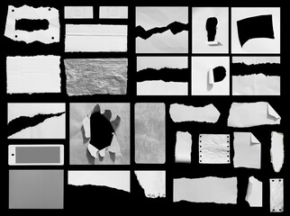 Set of ripped paper isolated on black background.