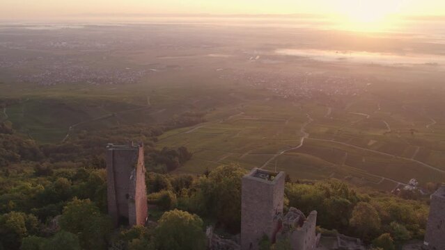 Panoramic view of The Three Castles of Eguisheim with misty morning, aerial 4k