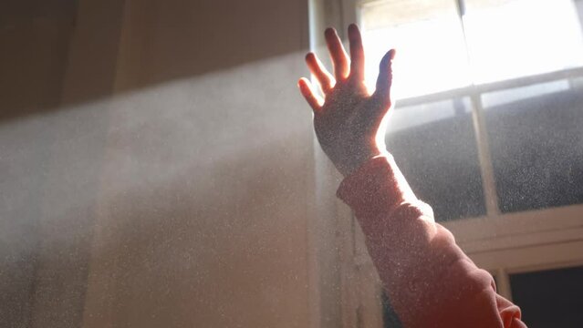 Caucasian hand basking in sunrays near window,closeup shot