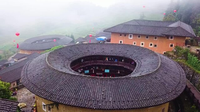 Aerial Pull-In Shot of a Unesco World Heritage Tulou in Fujian Province, China