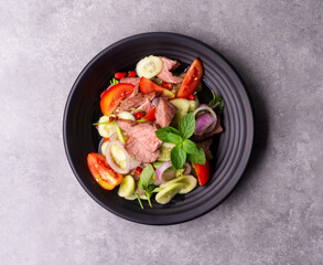 Beef salad with green vegetables Grilled beef salad Thai food Healthy beef salad menu with tomato pepper, garlic, spices Lunch Dinner