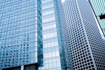 Bottom view of modern business office building window close up in center hongkong city.