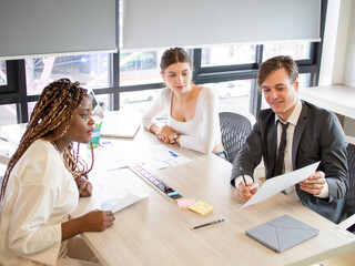 Businesswoman businessman male female lady person people group teamwork brainstorm corporate partner friend talk speak knowledge education business university high school strategy student paperwork   