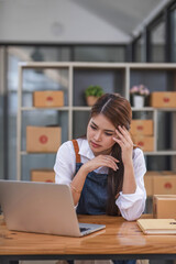 Small Business, Startup SME, Owner Entrepreneurs. Asian woman with unsuccess business online shopping crying and serious face unhappy mood.