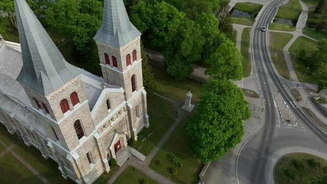 Aerial approaching view of Rapla Maarja-Magdaleena Church which is the only rural church with two towers in Estonia.