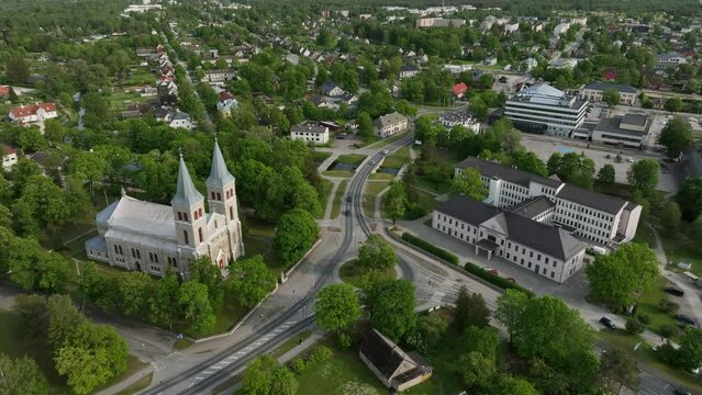 Slowly rotating aerial establishing shot of Rapla city centre with Maarja-Magdaleena Church which is the only rural church with two towers in Estonia.